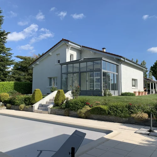 Photo d'une réalisation de véranda contemporaine